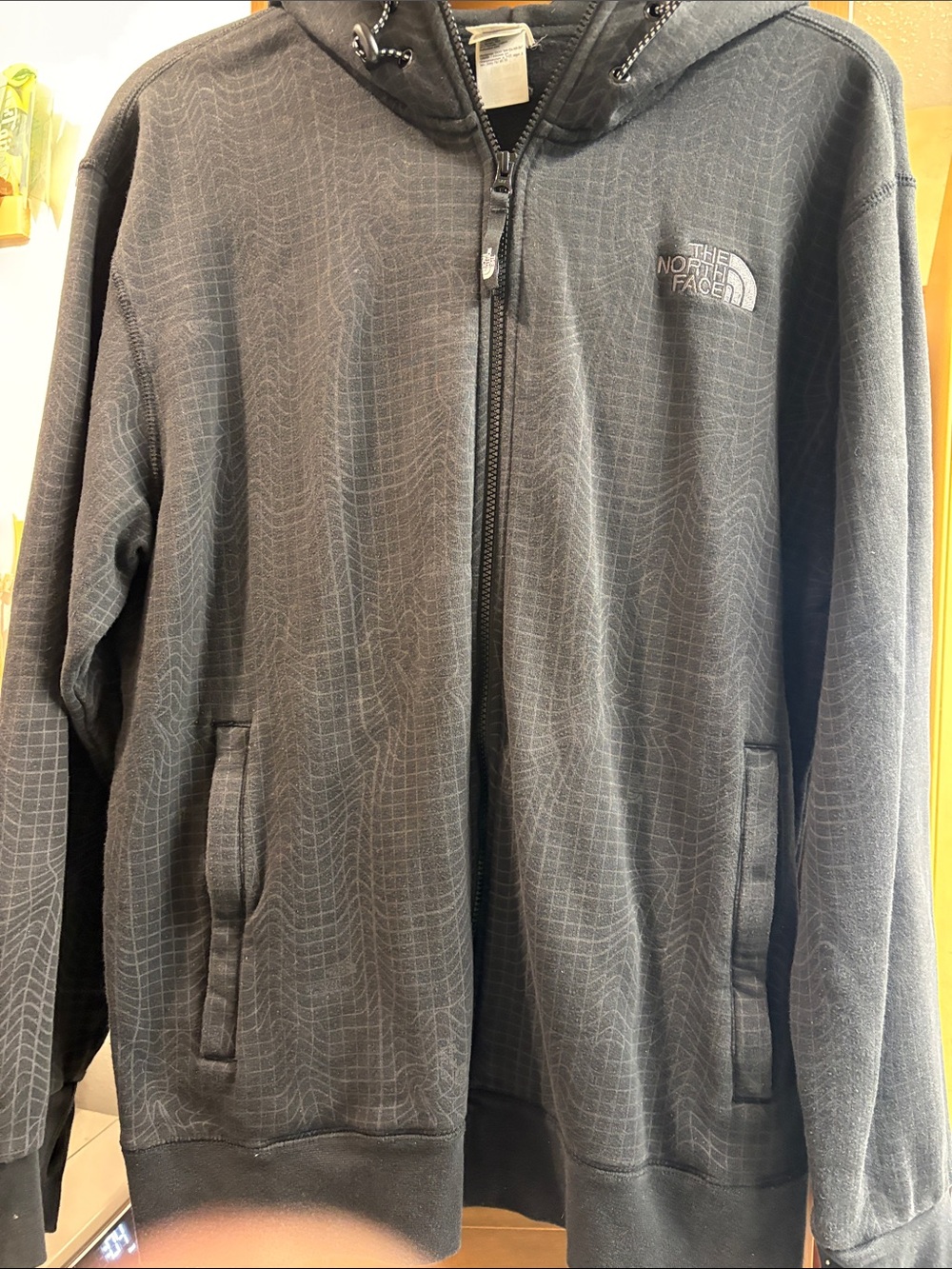 The North Face Black Hooded Zip Jacket with Subtle Grid Pattern